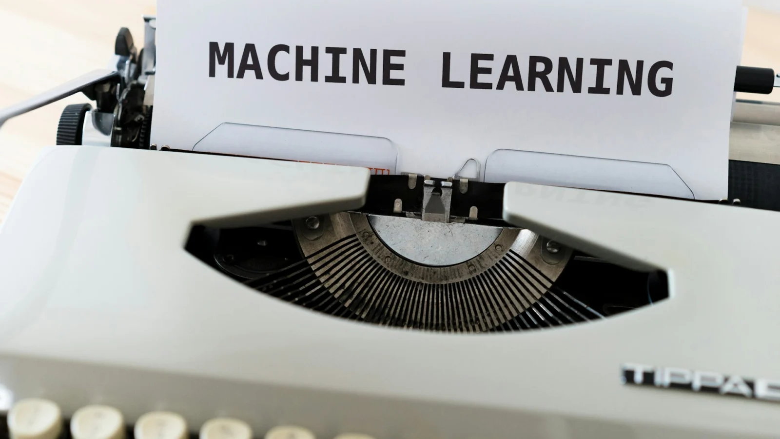 Typewriter with a sheet of paper reading machine learning