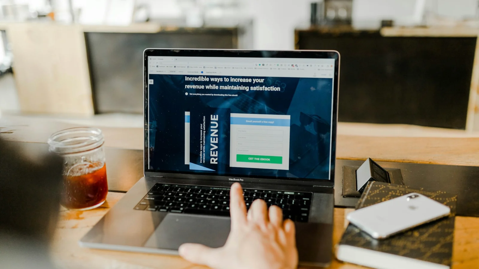Person using a laptop with a financial dashboard on screen