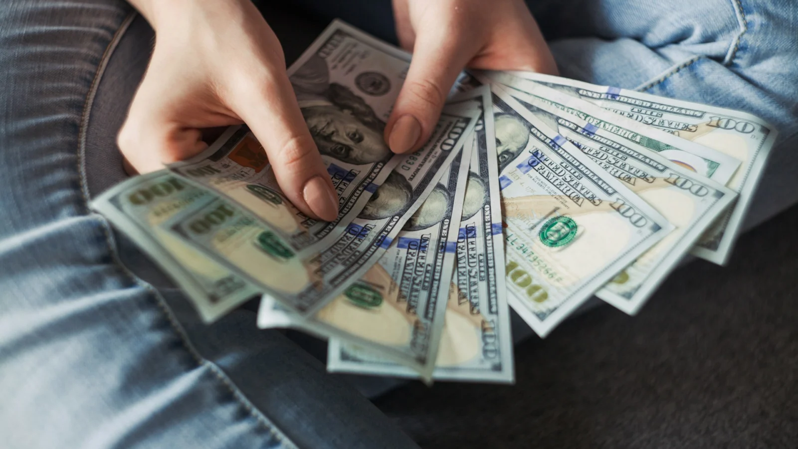 Hands counting banknotes