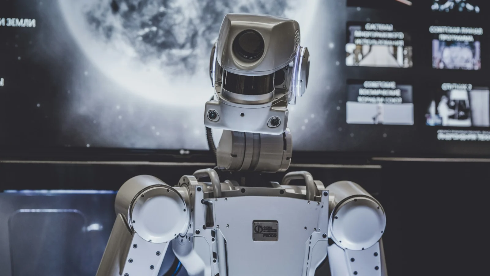 Humanoid robot with exposed joints in a workshop